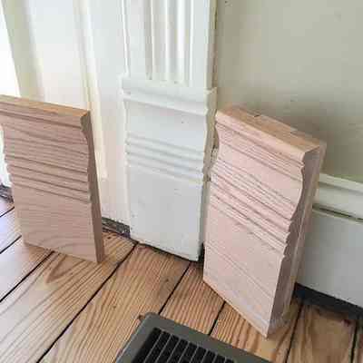 Example from the intenet of doorway plinth block moldings without the circular bullseye detail.