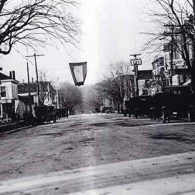 96-105-39_Butler_St._No._1925.jpg 3.1MB: 96-105-39 Butler St. 1925 with flag hanging in middle of the street