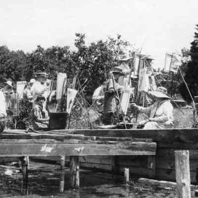 Farmer-class030.jpg 340KB: Painting Farmer Brown, seated on dock