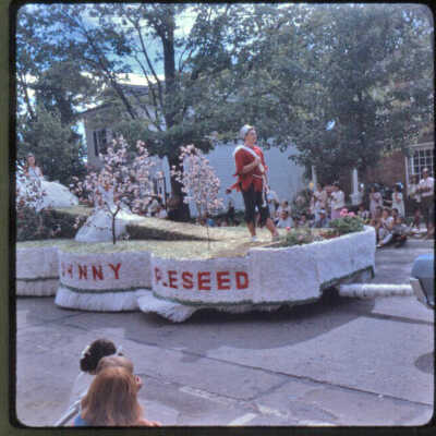 Page E Slide 3. Johnny Appleseed float, same parade as E1