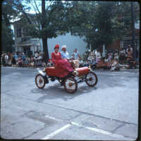          Page E 2. Electric car in same parade as E1
   