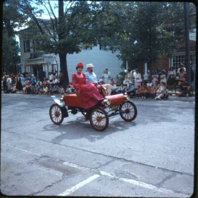 Page E 2. Electric car in same parade as E1