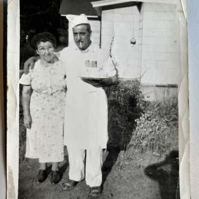 7: "Guilo & Mom (Bertha Diepenhorst) when Guilo Mocini  became a U.S.A. citizen with the cake mom made for him. John's mother Bertha at Walton"