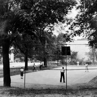 95 84 23 Tennis courts.jpg 1.4MB: Photo of the tennis court with Maplewood Hotel visible from across Butler street. Original in box 31, envelope 95-84-23