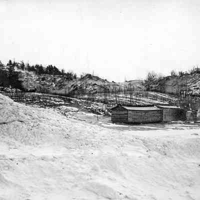 HM75BirdBathouseWinter.jpg 977KB: This image was featured as History Mystery #73 with the solution: The Bird Bathhouse shown here ca 1907 was located where the Oval Beach was created thirty years later.

Hi Sally, This beach house was located in the area of the present day oval. When the Forward Movement [later the Church Camp/Camp Gray] opened in the early 1900s a road was constructed from the Kalamazoo River ferry landing  to the FM camp. The road also created easier access to the Oval area. And the access led to use of the beach area followed by creation of the Bird Bathhouse. See attached photo. The photographer was out on the ice, making the bath house look further from the waters edge. Note the tower atop Mt Baldhead on the upper left.  Jack [via email, 5 Apr 2023]