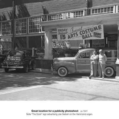 aa149PavilionCars.jpg 1.4MB: Great location for a publicity photoshoot, ca 1941, Note "the Dock" sign advertising Joe Gerken on the Hammond organ. Annual Arts Costume Ball, pa137 -- Digital file on Jack Sheridan Drive 2021.72.02