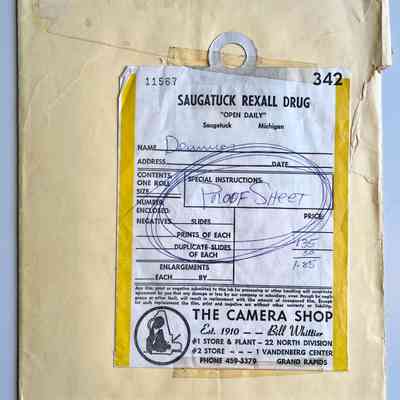 The negatives and proof sheet are in an envelope with processing form from Saugatuck Rexall Drug and The Camera Shop / Bill Whittier in Grand Rapids
