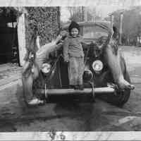          89-1-108 E. Herbert w deer.jpg 284KB; A child posing with two dead dear tied to the hood of a car
   