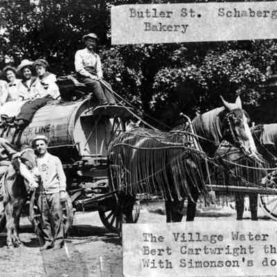 Village_water_wagon.jpg 547KB - likely from Hoffman photo album 2022.34.01: Butler St. Schaberg's Bakery, The Village Water Wagon Bert Cartwright the Driver with Simon's donkey [Dynamite]