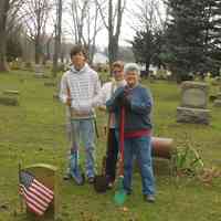          D4-2011-2-cr.jpg 559KB; DDDD 2010
For a second year, a hardy crew braved windy weather to plant 36 dozen daffodils at graves in Riverside, Douglas and Taylor cemeteries. Plots were selected, in the most part, to address folks with no descendants or no local ones remaining. Thanks to HUNTREE for providing a 12 dozen of the bulbs used. Volunteers included Joy Muhlenbeck, Doreen and Nathan Tubergen, Charlie Hancock and Chris Yoder.  A brief sketch of those recognized appears below:
Riverside
1. Rev Ezra Scovel (1794-1874) -Graduate of Middlebury College, VT. Pastored in Mexico, NY and elsewhere. 