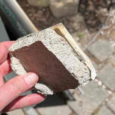 Most of the beige 3" tiles have mortar on the back.