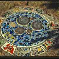          ArtPlate.jpg 2MB; Grave for year 1998 with lily pads and glass mosiac
   