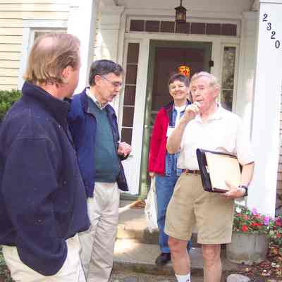Pier Cover tour by Bob Simonds (with clipboard) outside 2320