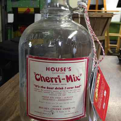 Cherry-Mix bottle with "Save the Barrel" fundraiser tag.