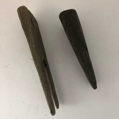 Wooden 19 th century logging pins: Side view of two hand carved 19 th century logging pins 