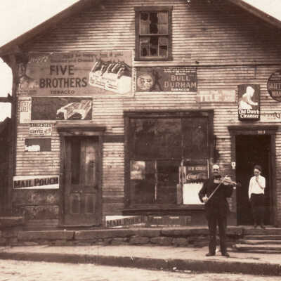 Supler John Wise [1853-1926] in front of his grocery store on West Maiden Street in Washington