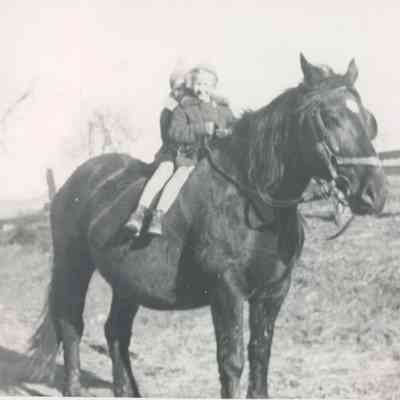 Margery Ellen (Moore) Whetzel [1930-2025] and Edna Maude (Moore) Randolph [1931-] on horse "Betty"