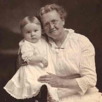 Mary Ellen (Smith) Milliken holding one of her grandchildren