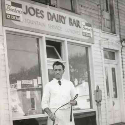 Joseph C. Russo [1900-1990] standing in front Joe's Dairy Bar