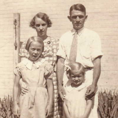 Roy Evans and his wife, Margaret Marsalene (Miller) Evans, with their daughters