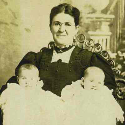 Mary Jane (Elms) Elms holding her twin granddaughters