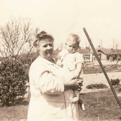 Louie (Stewart) Jacobs [1871-1942] holding unidentified child