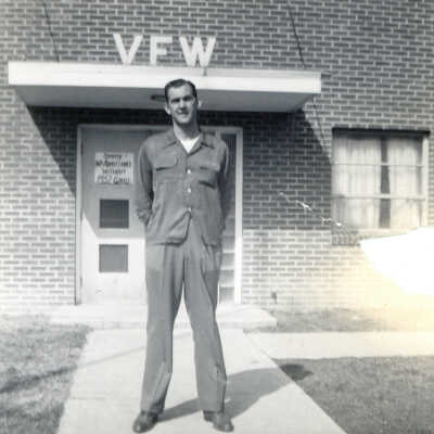 Unidentified man in front of Veterans of Foreign Wars (VFW) building on Lincoln Street in Waynesburg, Greene County, Pennsylvania