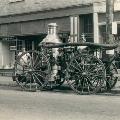 Water pump for firefighting displayed in front of the Levine Furniture Store on High Street in Waynesburg, Pennsylvania