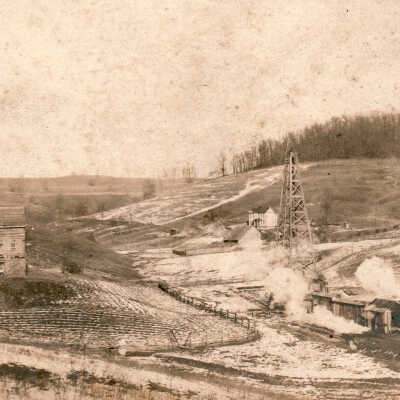 Wooden derrick and log cabin located between Spraggs and Brock in Wayne Township, Greene County, Pennsylvania