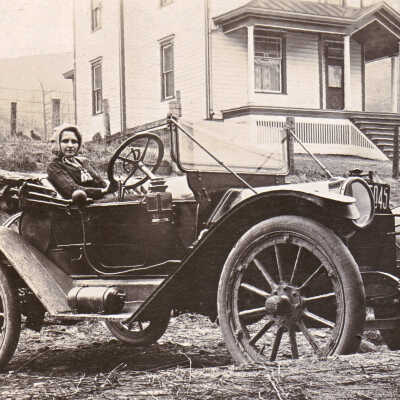 Ida (Rinehart) Woodruff [1891-1973] in their first car, a Buick