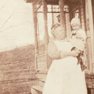 Louie (Stewart) Jacobs [1871-1942] holding unidentified child