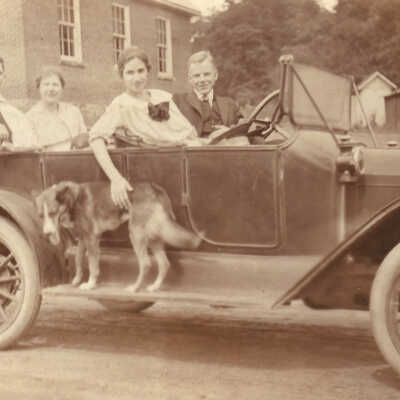 Alfred M. Throckmorton [Driving] / Nancy Laureanne (Throckmorton) Meighen [Female, back seat]