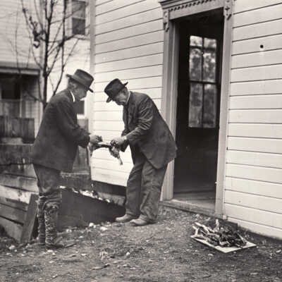 Henry Clay Sayers Sr. [1840-1926] and Henry Clay Sayers Jr. [1872-1945] at their home, on the corner of Franklin Street and Blackberry Alley