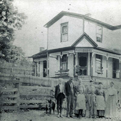 Marion Jasper Clovis and Sarah Eliza (Eakin) Clovis family in front of their home