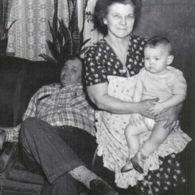 Stacy Niles Staggers and his wife, Nellie Mae (Rush) Staggers, holding one of their grandchildren