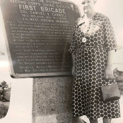 Frank Jones Album (Selected Photos) - Lydia (White) Jones with plaque that marks position occupied by 7th W. Va. Volunteer Infantry