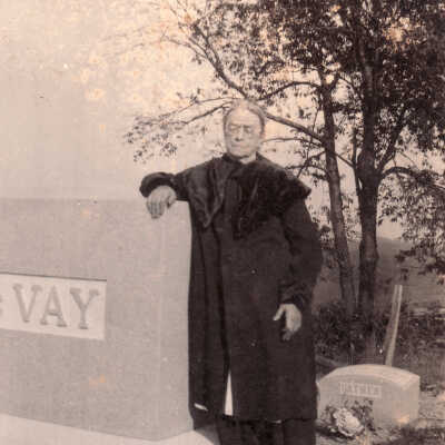Almyra "Myra" (Wilson) McVay at the grave of her husband Randolph M. "Mac" McVay