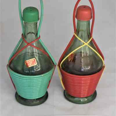 Other side and size comparison of wine bottles salt and pepper shakers.