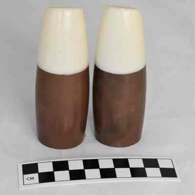 Back and size comparison of modernist salt and pepper shakers.