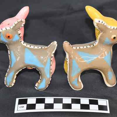 Other side and size comparison of donkey salt and pepper shakers.