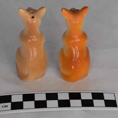 Back and size comparison of kangaroo salt and pepper shakers.