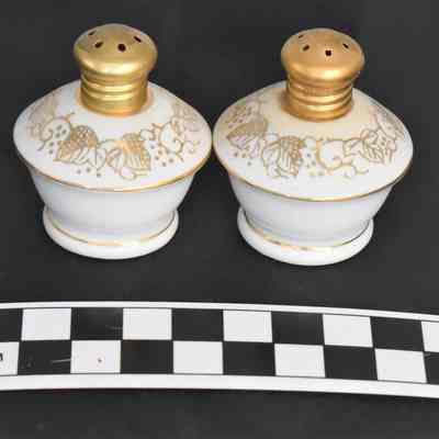 Other side and size comparison of L.Rice salt and pepper shakers.