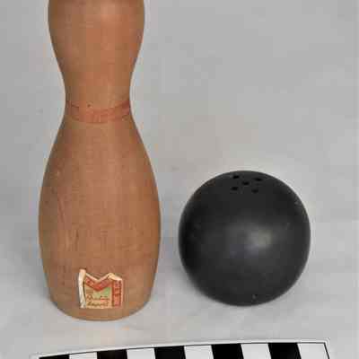 Back and size comparison of bowling salt and pepper shakers.