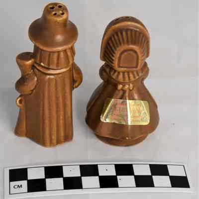 Back and size comparison of pilgrim salt and pepper shakers.