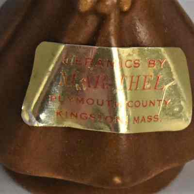 Original label on woman salt shaker.
