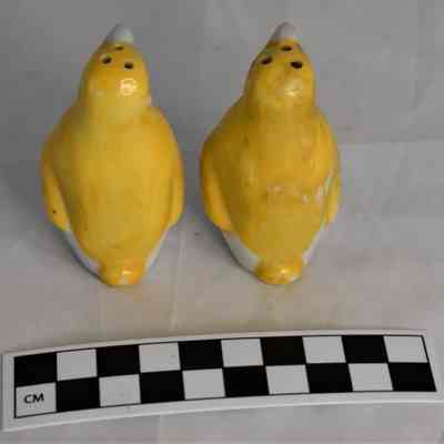 Back and size comparison of penguin shakers.