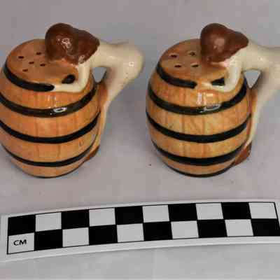 Back and size comparison of ladies/barrels salt and pepper shakers.