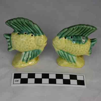 Flipped view and size comparison of the fish salt and pepper shakers.