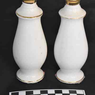 Back and size comparison of floral salt and pepper shakers.