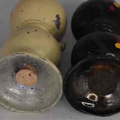 Embossed on bottom of each shaker "Japan".